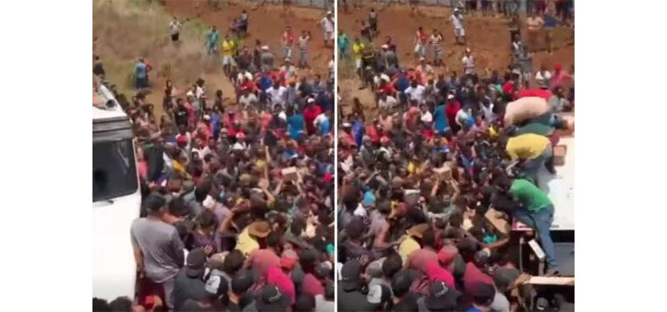 Caminhão tomba na MT-235 e centenas de pessoas atacam e saqueiam carga de salsicha e mortadela